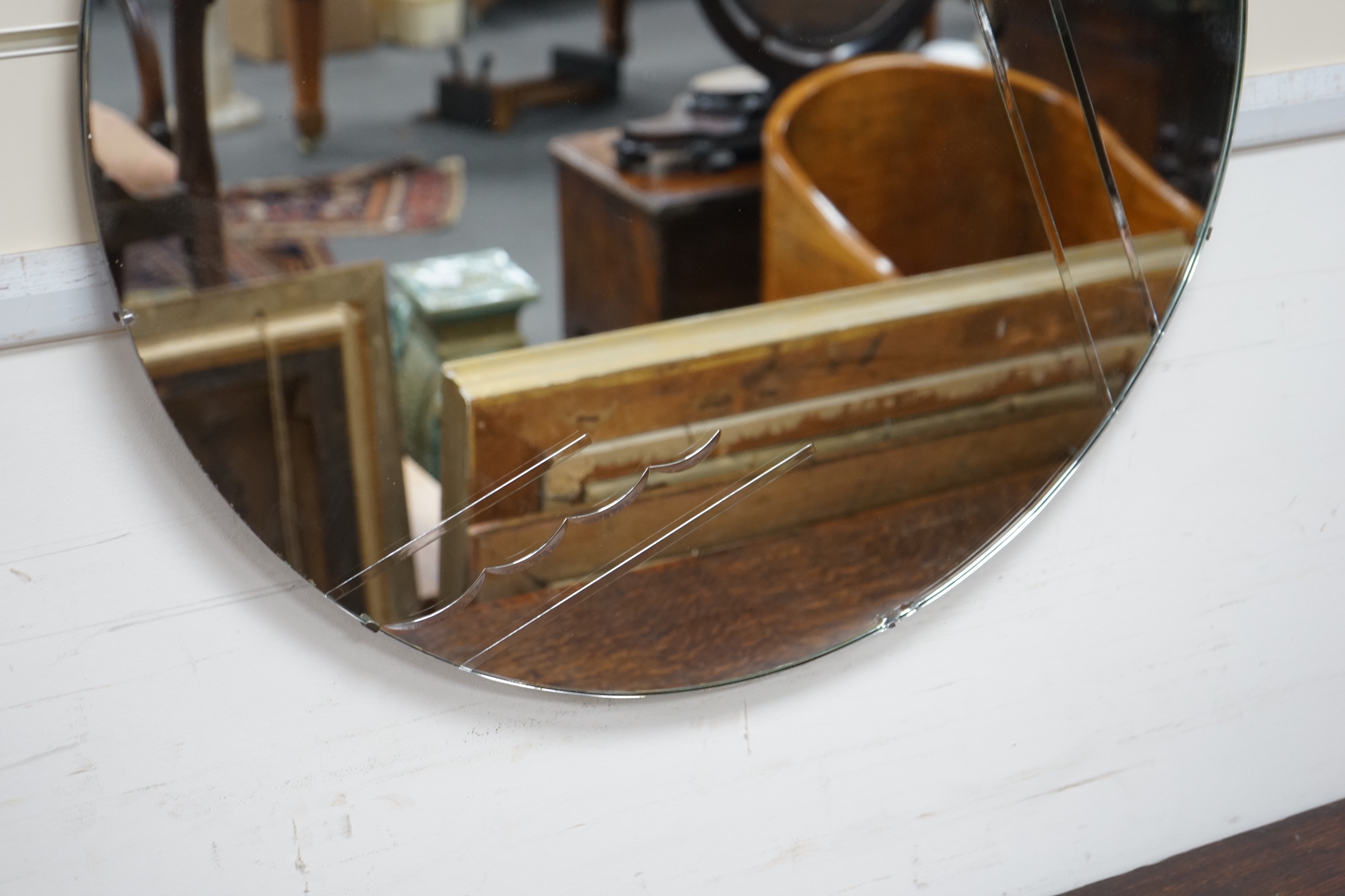 A circular Art Deco wall mirror, 66cm diameter